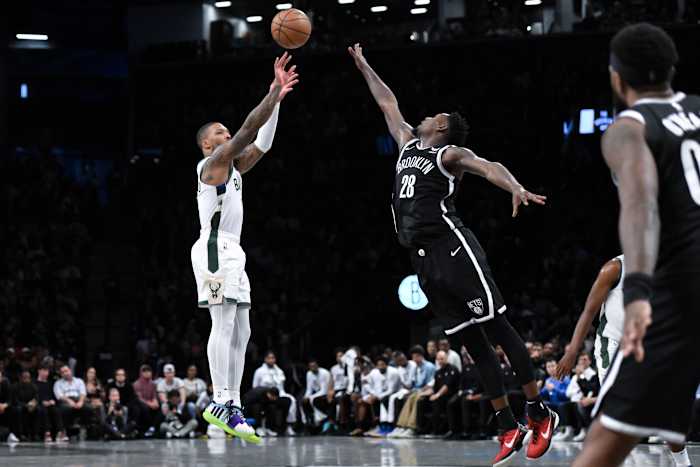 Milwaukee Bucks guard Damian Lillard (0) shoots the ball against Brooklyn Nets forward Dorian Finney-Smith (28)